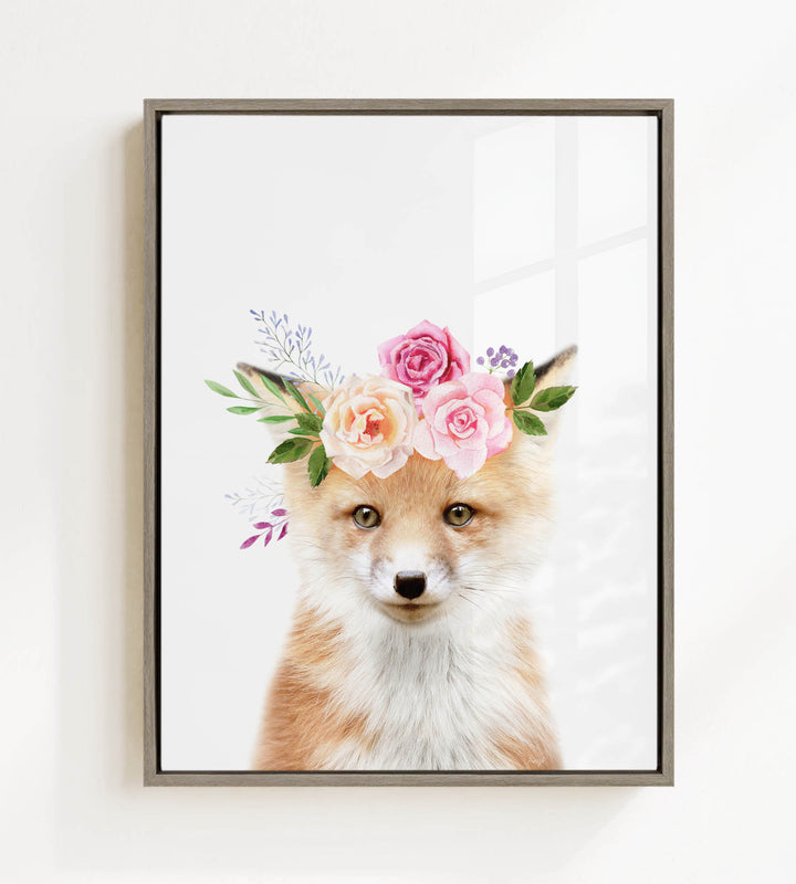 A fox wearing a floral crown of pink and white roses and green leaves.