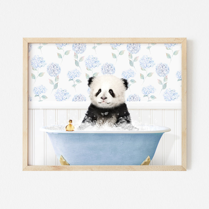 a panda bear sitting in a bath tub