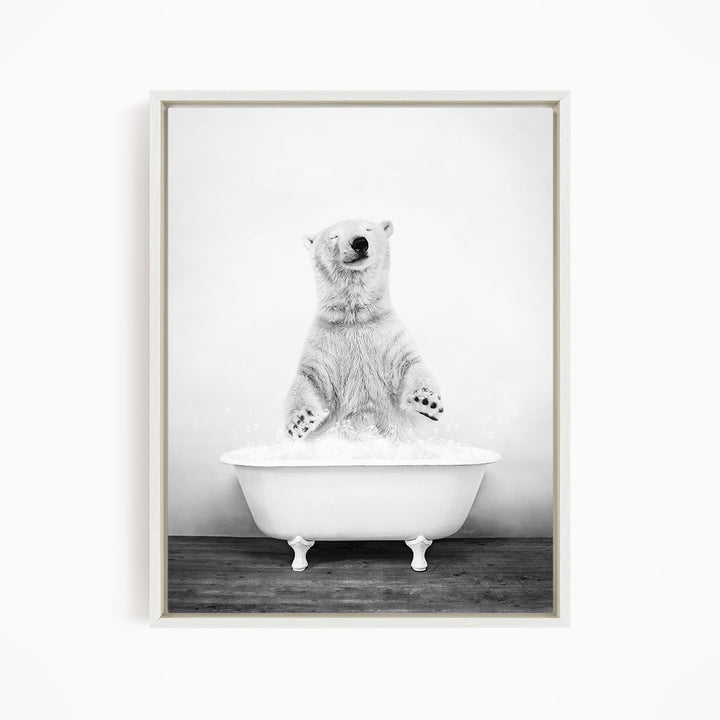 A polar bear standing in a white bathtub filled with water, appearing to be enjoying a bath.