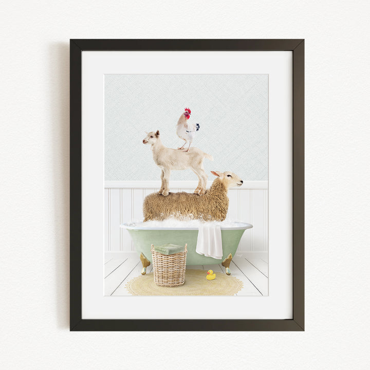 A framed image depicting a goat standing on a sheep's back while a chicken sits on top of the sheep, all in a bathtub.