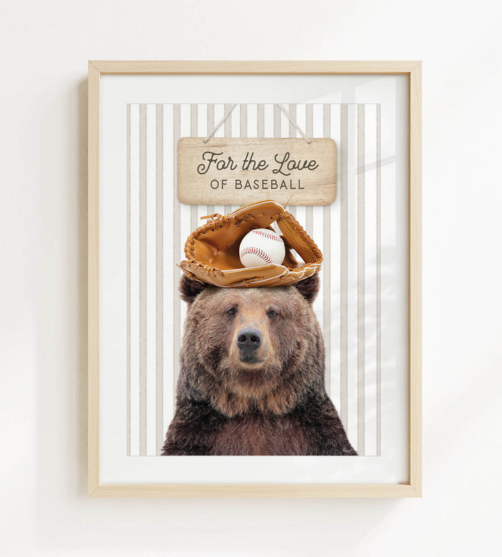 A framed image of a brown bear wearing a baseball glove and holding a baseball, with a sign above that says "For the Love of Baseball".