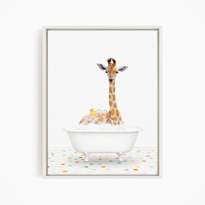A giraffe is sitting in a white bathtub filled with bubbles, surrounded by a yellow rubber duck.