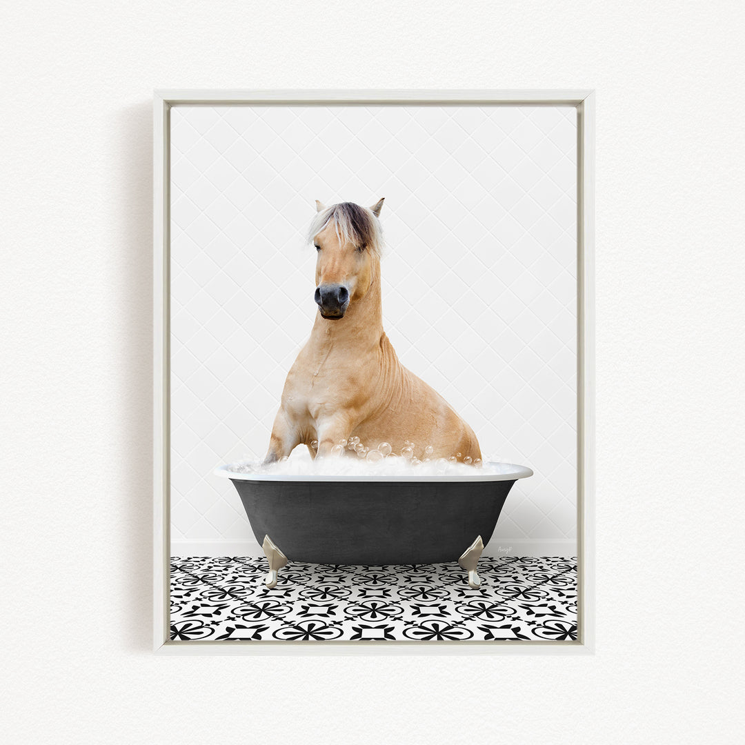 A light brown horse is sitting in a black bathtub filled with water, creating a whimsical and playful scene.