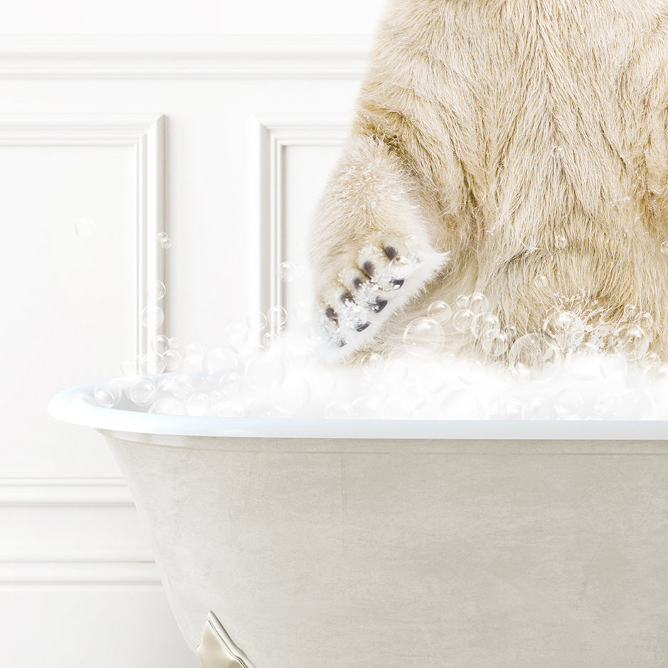 a polar bear sitting in a bathtub full of bubbles