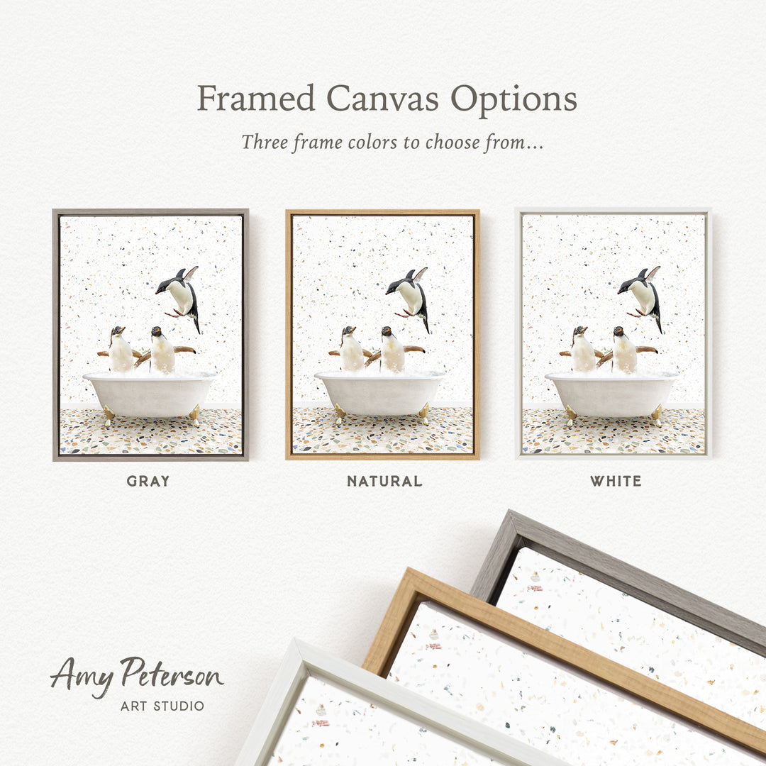 The image is a framed canvas option showcasing three different frame colors: gray, natural, and white. The canvas features a scene of penguins in a bathtub, with the penguins depicted in various poses and colors.