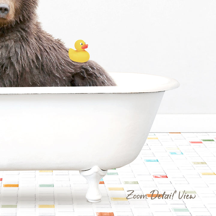 A brown bear sitting in a white bathtub, with a yellow rubber duck floating on its back.