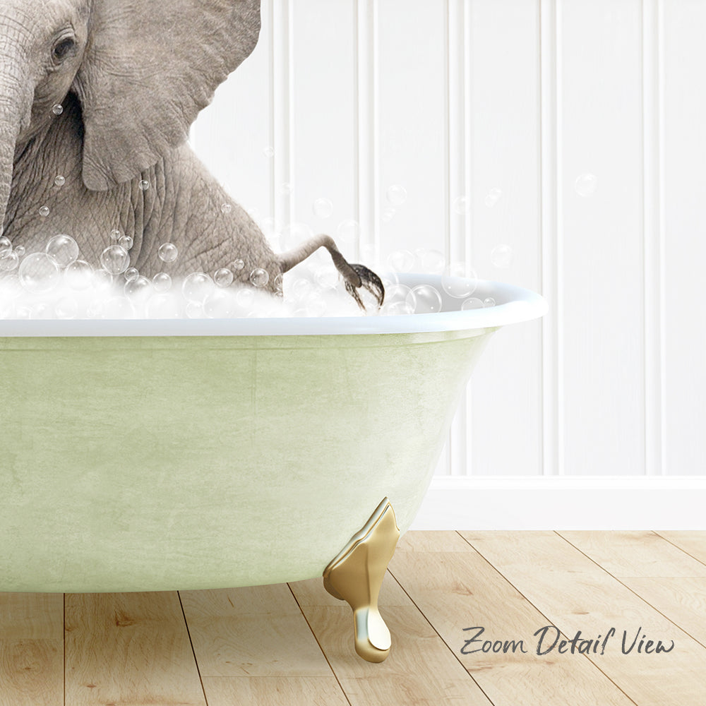 A large elephant is sitting in a green bathtub filled with bubbles, creating a whimsical and playful scene.