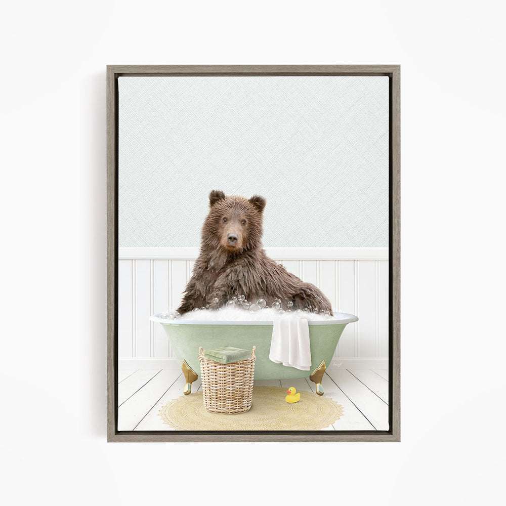 A brown bear sitting in a green bathtub filled with bubbles, surrounded by a basket of toys and a yellow rubber duck.