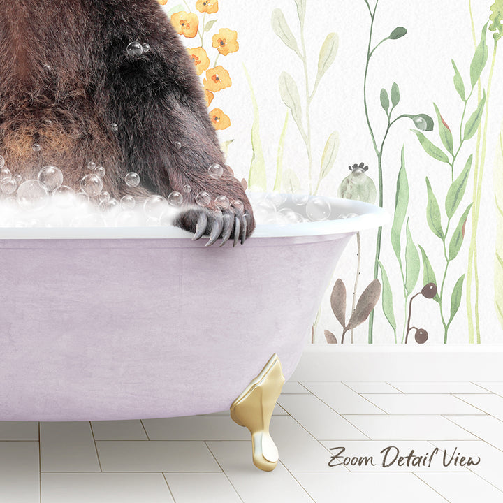 A close-up of a bear's paw resting on a pink bathtub filled with bubbles, with a floral wallpaper in the background.