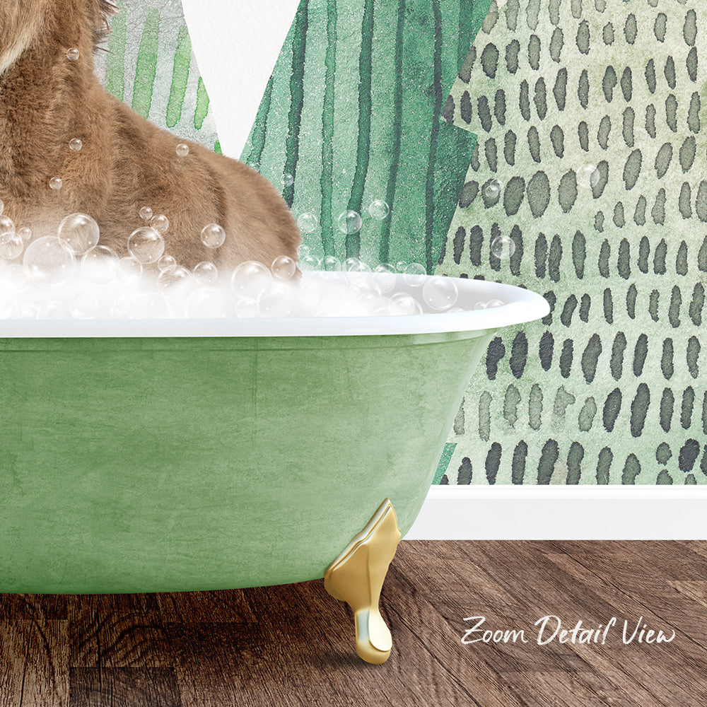 A cat is sitting in a green bathtub filled with bubbles, with a patterned wall in the background.