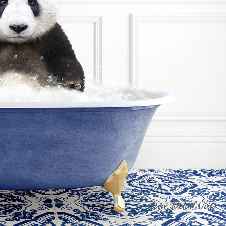 A panda bear sitting in a blue bathtub filled with bubbles, with a patterned tile floor in the background.