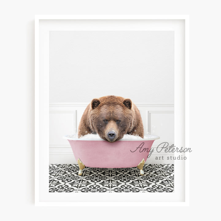 a brown bear sitting in a pink bath tub