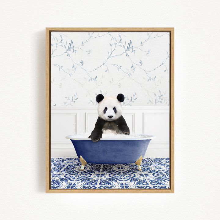 A panda bear sitting in a blue bathtub, surrounded by a blue and white patterned rug on the floor.