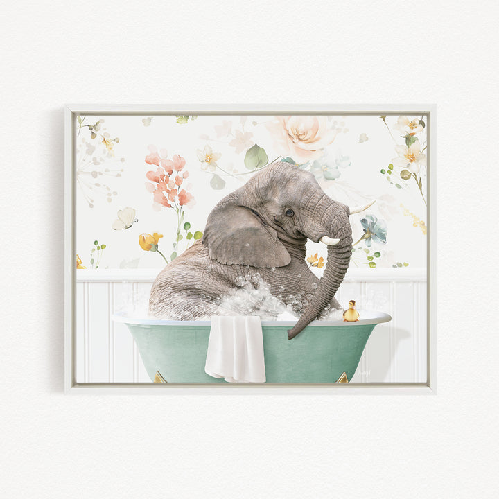 A gray elephant is sitting in a green bathtub filled with water, surrounded by a floral pattern.