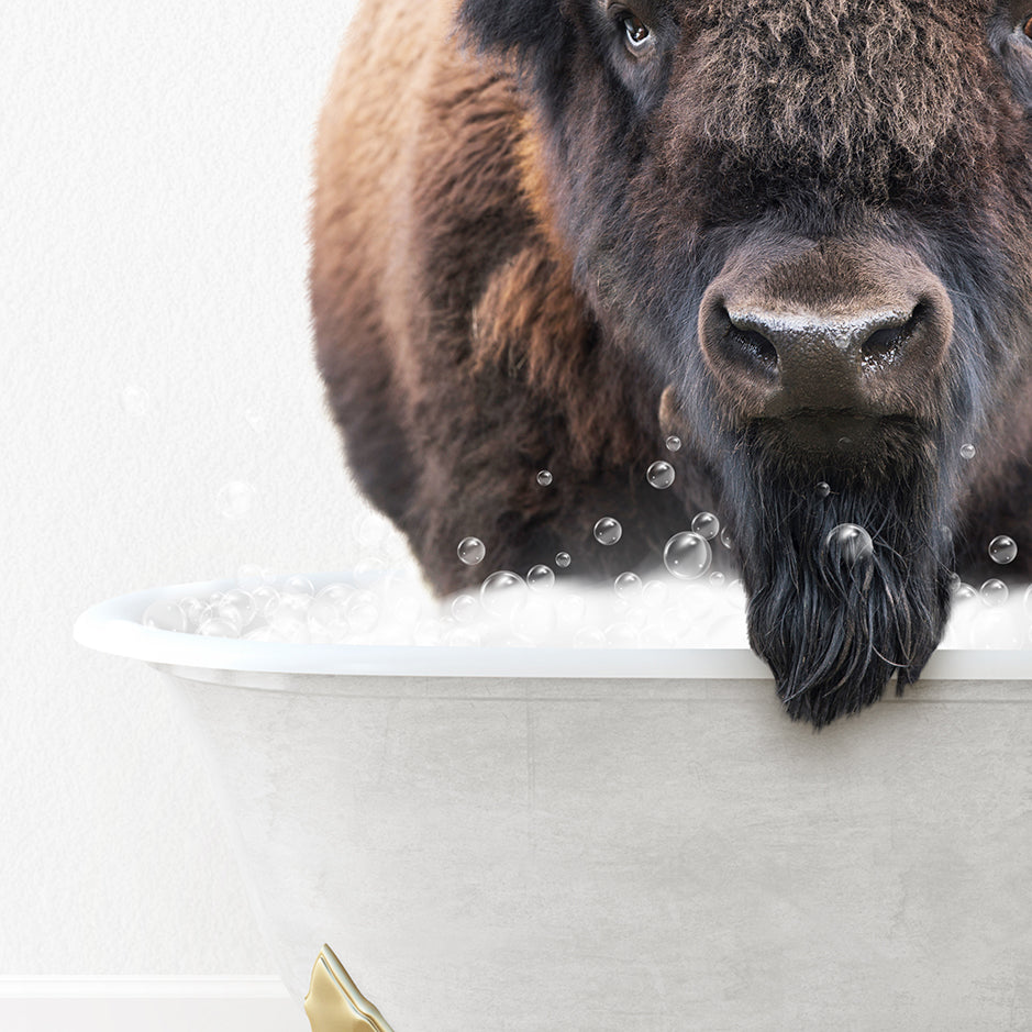 a large buffalo standing in a bathtub filled with bubbles