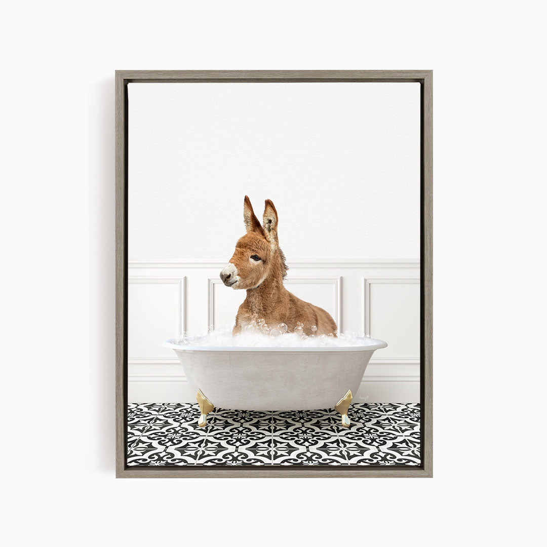A donkey is sitting in a white bathtub filled with bubbles, creating a whimsical and playful scene.