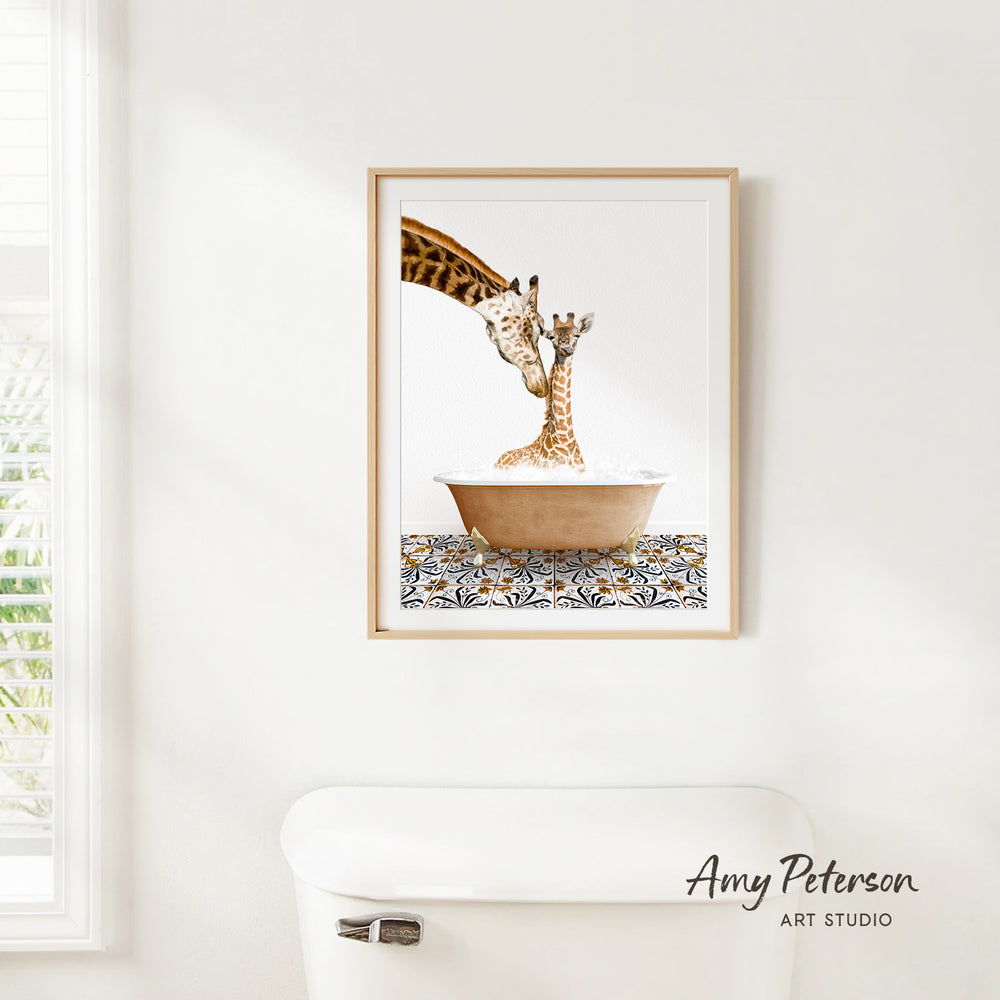 A framed painting of two giraffes in a bathtub, with one giraffe appearing to be a baby giraffe.