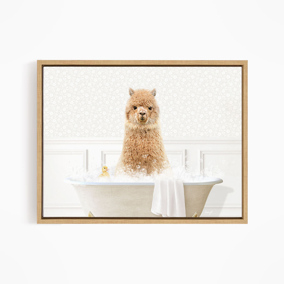 A fluffy brown alpaca sitting in a white bathtub filled with bubbles, with a yellow rubber duck floating nearby.