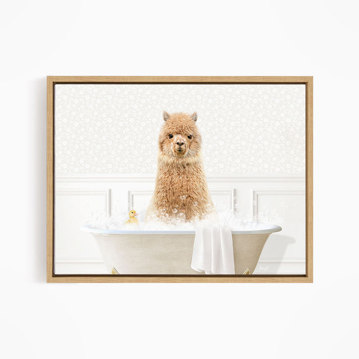 A fluffy brown alpaca sitting in a white bathtub filled with bubbles, with a yellow rubber duck floating nearby.