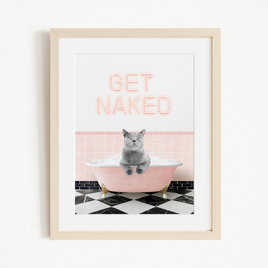 A framed image depicting a gray cat sitting in a pink bathtub, with the text "GET NAKED" displayed above it.