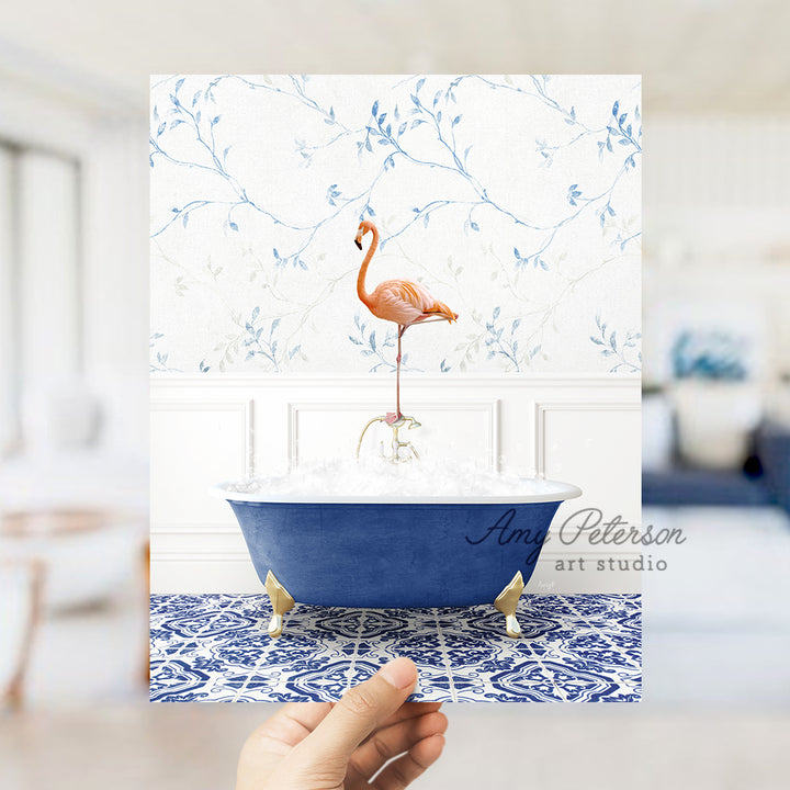 a person holding a card with a flamingo in a bathtub