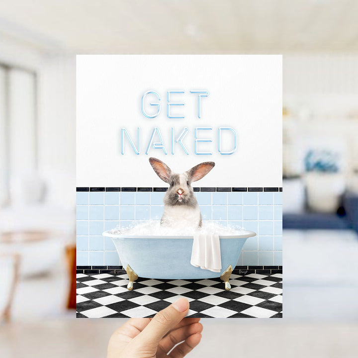 A hand holding a card with a picture of a rabbit sitting in a bathtub, with the text "GET NAKED" written on it.
