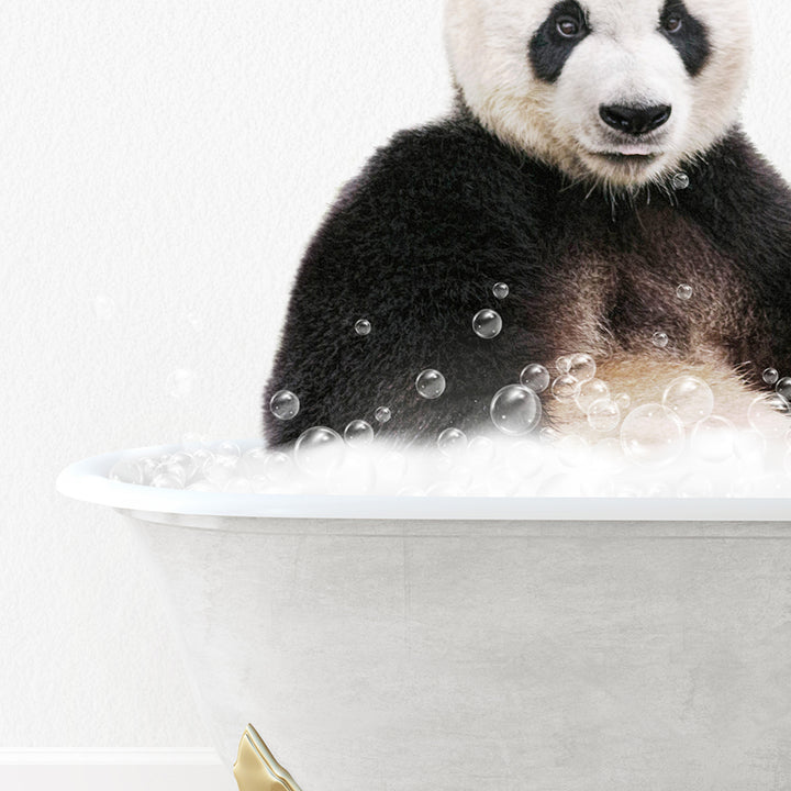 a panda bear sitting in a bathtub full of bubbles