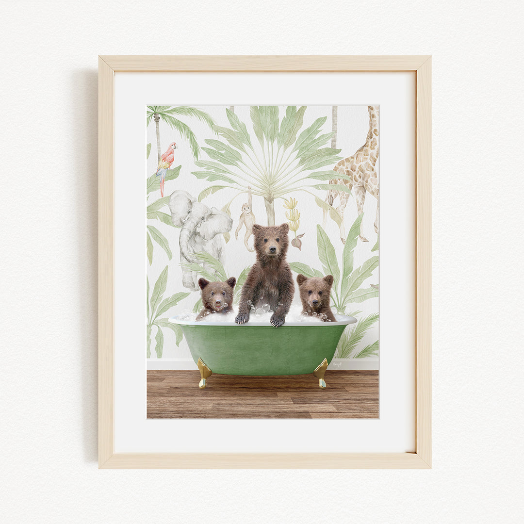 A framed print depicting three bears sitting in a green bathtub, surrounded by a tropical jungle wallpaper.