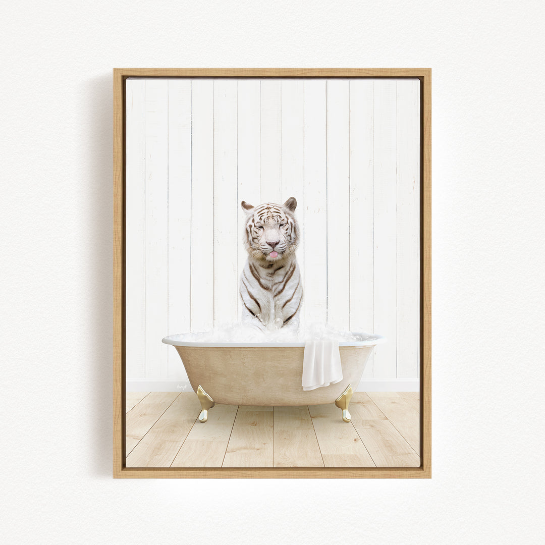 A white tiger is sitting in a bathtub filled with water, surrounded by a wooden floor and a white wall.