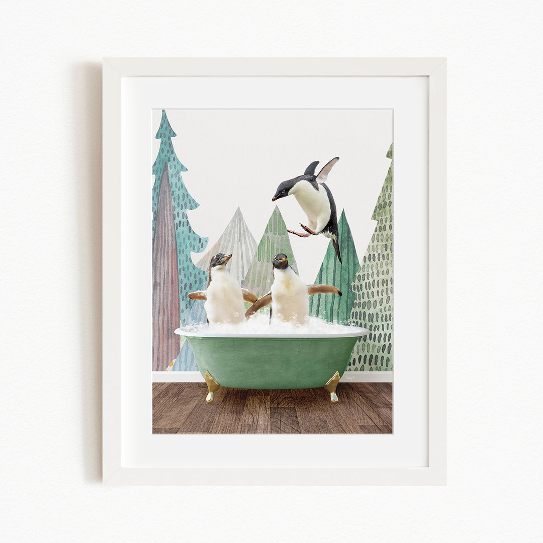 A framed image depicting two penguins sitting in a green bathtub, with one penguin flying towards the other in mid-air.
