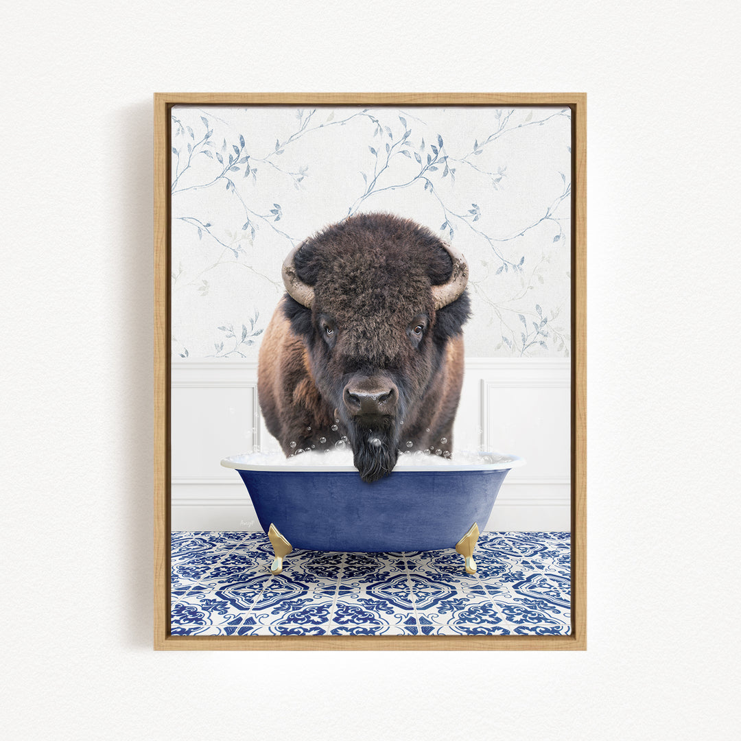 A buffalo with large horns is standing in a blue bathtub filled with water, creating a whimsical and humorous scene.