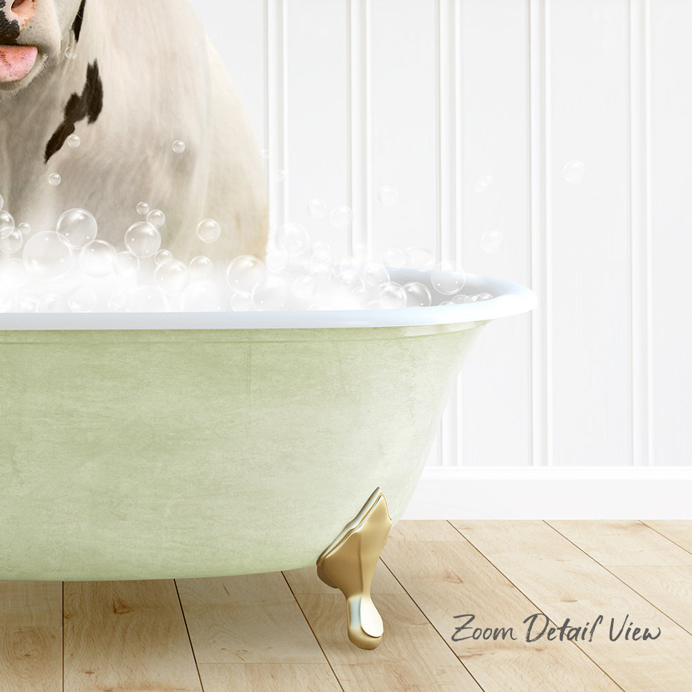A white dog is sitting in a green bathtub filled with bubbles, with a wooden floor and white walls in the background.