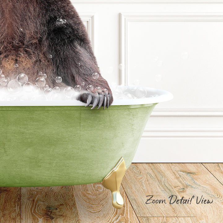 A close-up of a bear's paw in a green bathtub filled with bubbles, with a wooden floor and white wall in the background.