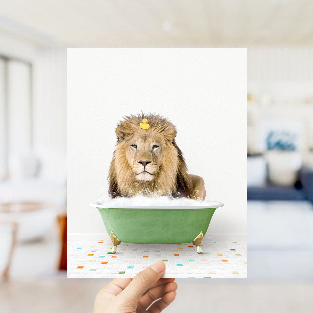 A lion is sitting in a green bathtub filled with bubbles, with a yellow rubber duck floating on its head.