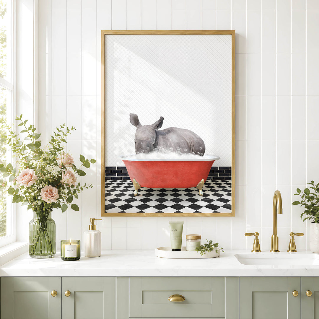a bathroom with a framed picture of a rhinoceros sitting in a red bathtub, surrounded by flowers and a black and white checkered floor.