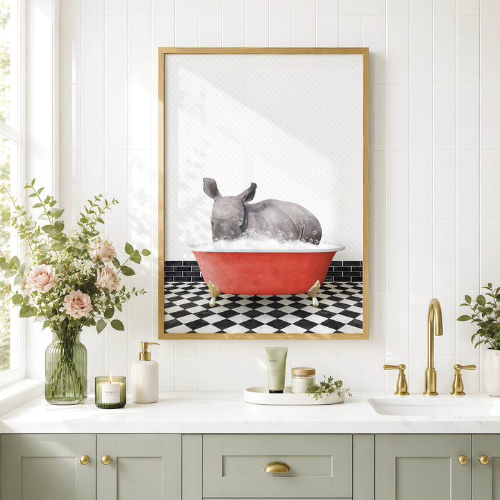 a bathroom with a framed picture of a rhinoceros sitting in a red bathtub, surrounded by flowers and a black and white checkered floor.