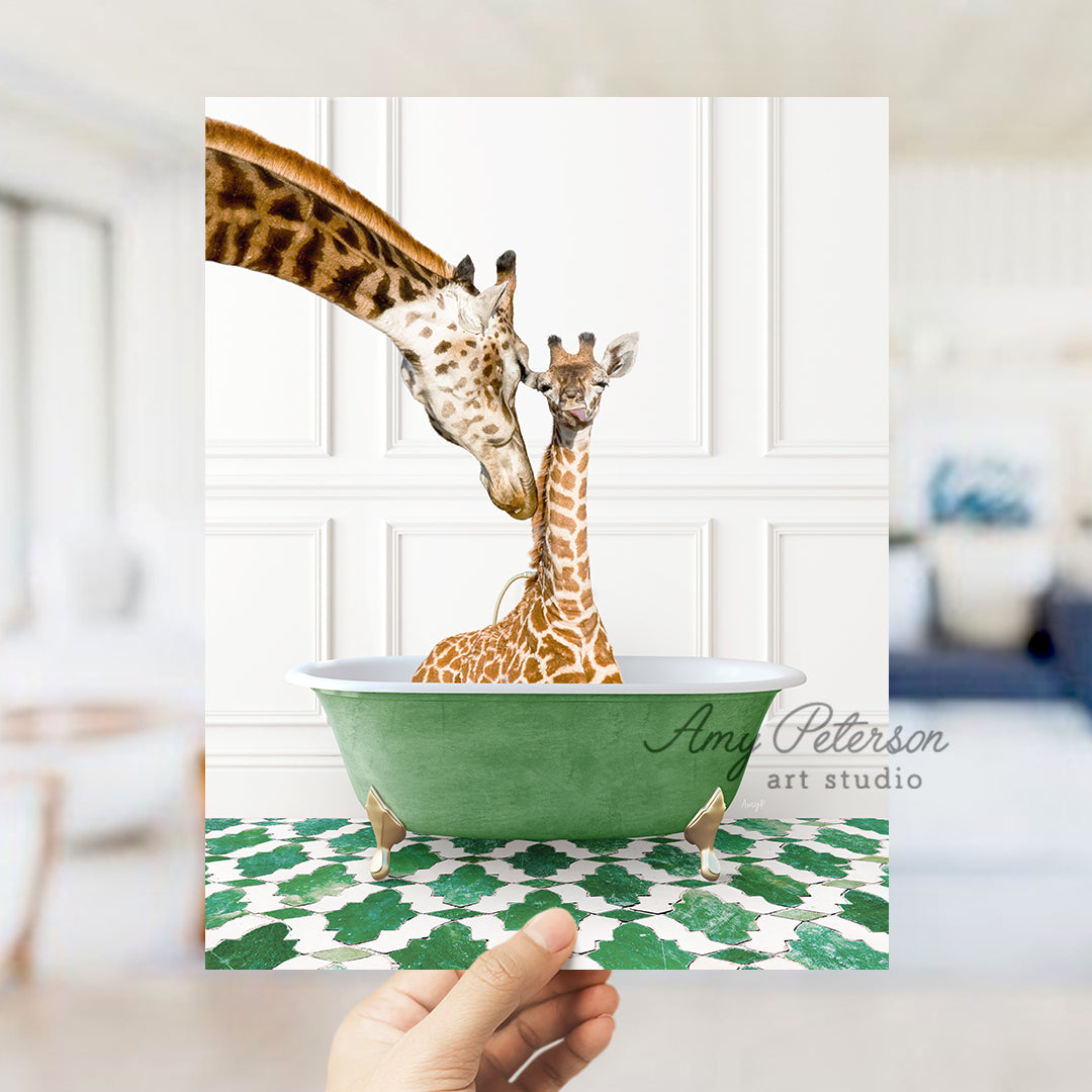 a hand holding a card with two giraffes in a bowl