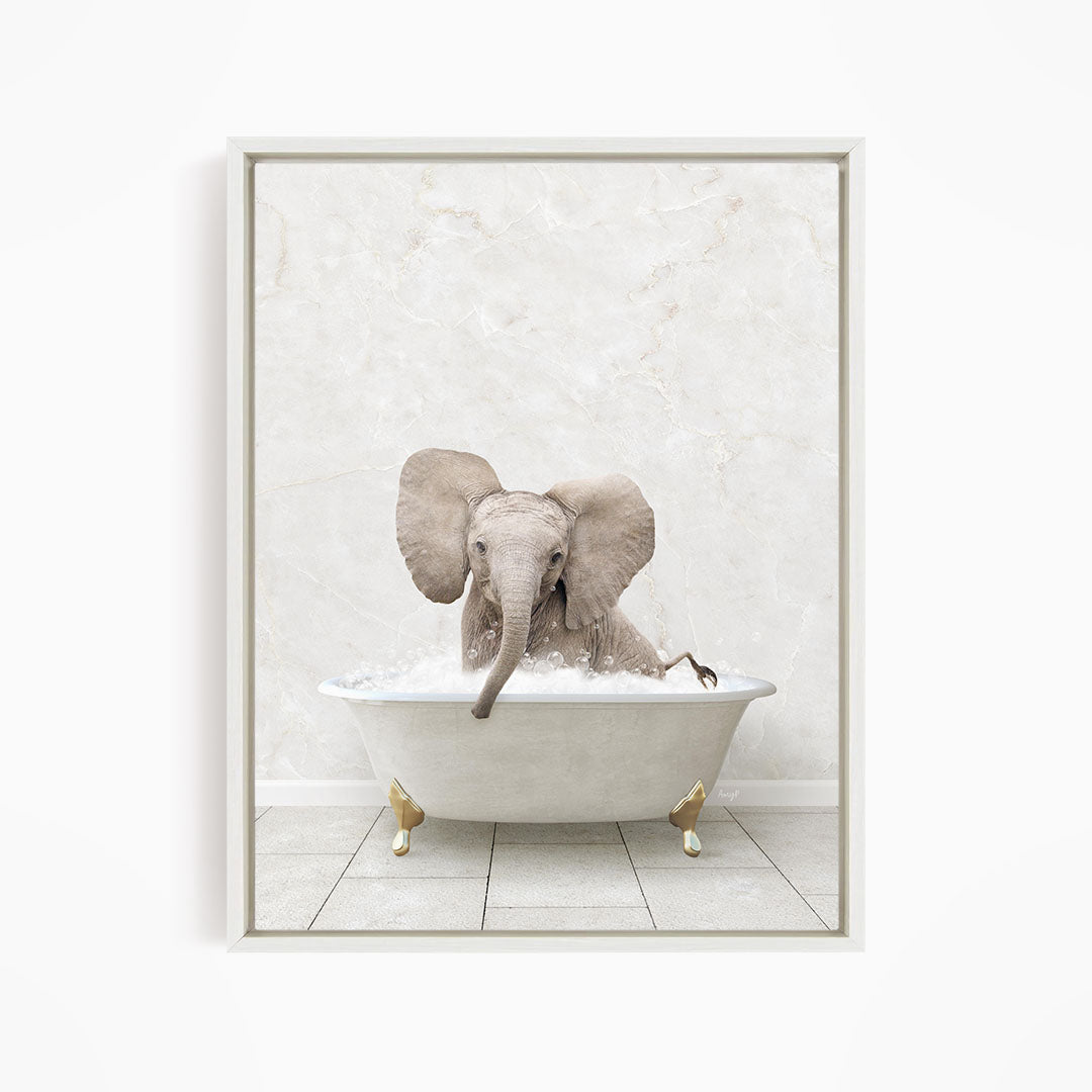 A baby elephant sitting in a white bathtub filled with water, appearing to enjoy the bath.