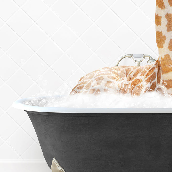 a giraffe laying down in a bath tub