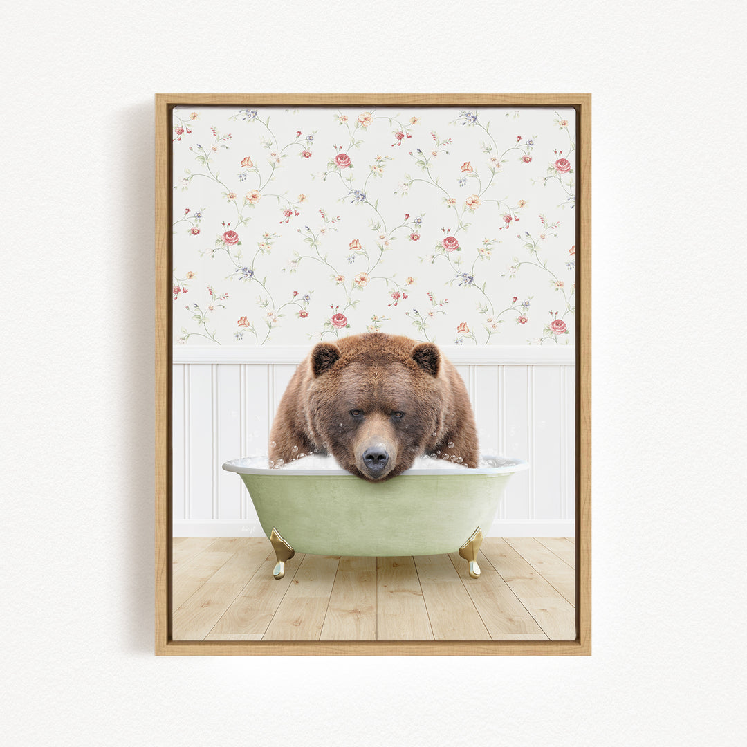 A brown bear is sitting in a green bathtub, appearing to be enjoying a relaxing bath.