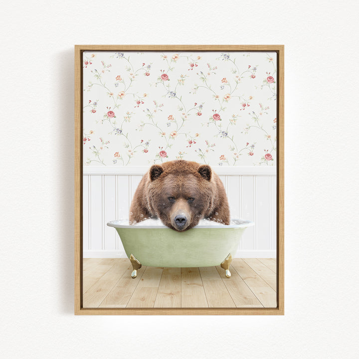 A brown bear is sitting in a green bathtub, appearing to be enjoying a relaxing bath.