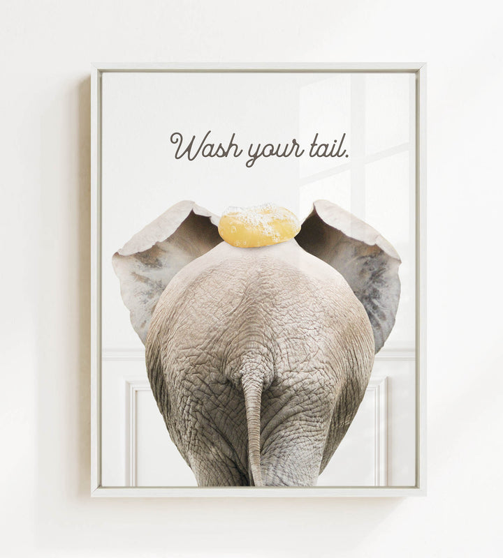 an elephant with a yellow object on its head, accompanied by the text "Wash your tail."
