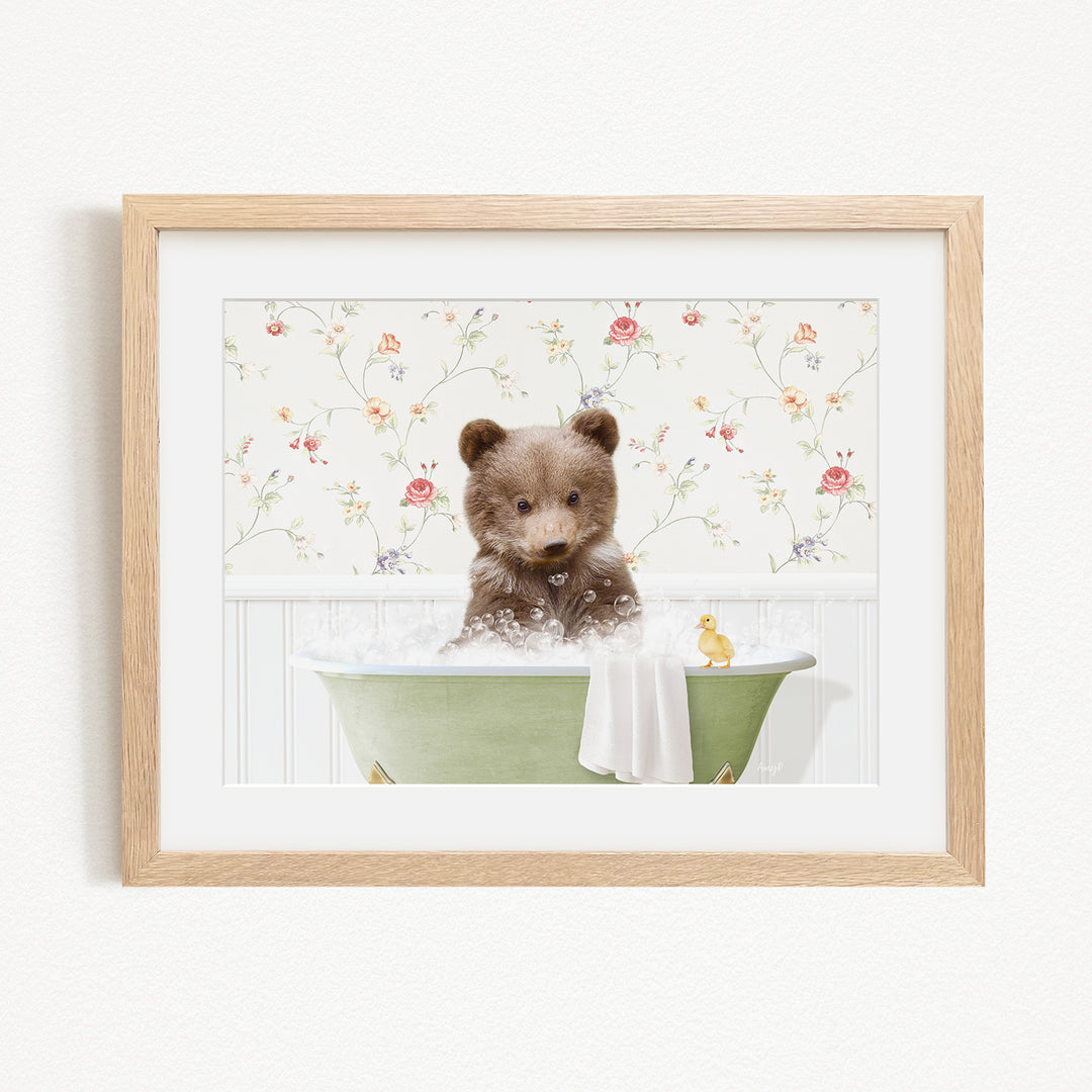 A cute brown bear sitting in a green bathtub filled with bubbles, surrounded by a floral wallpaper.