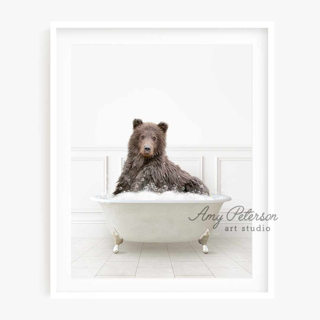 a brown bear sitting in a bath tub