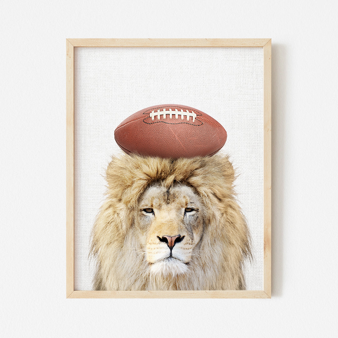 a lion with a football on its head