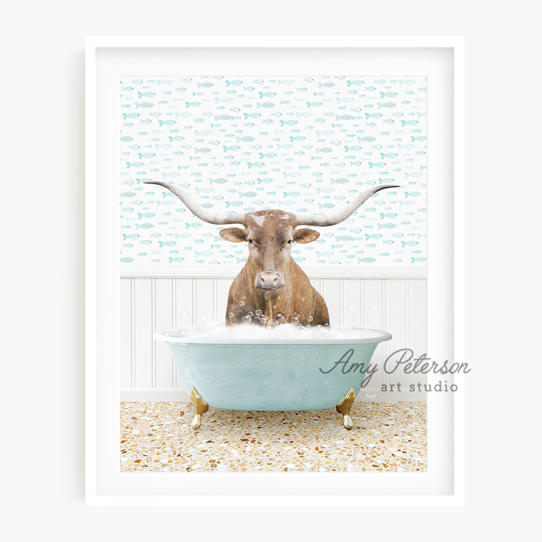 a cow with long horns sitting in a bathtub