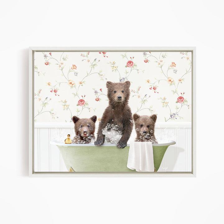 Three adorable brown bears sitting in a green bathtub, surrounded by a floral wallpaper.