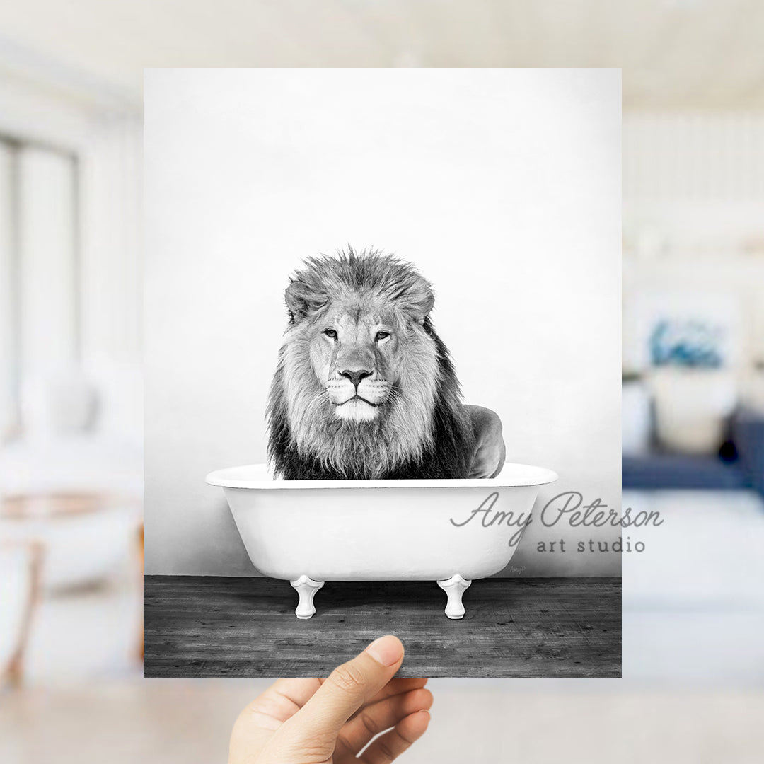 a black and white photo of a lion in a bathtub