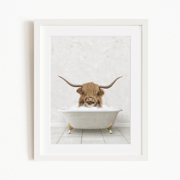 A brown cow with long horns is sitting in a white bathtub filled with water, creating a whimsical and humorous scene.