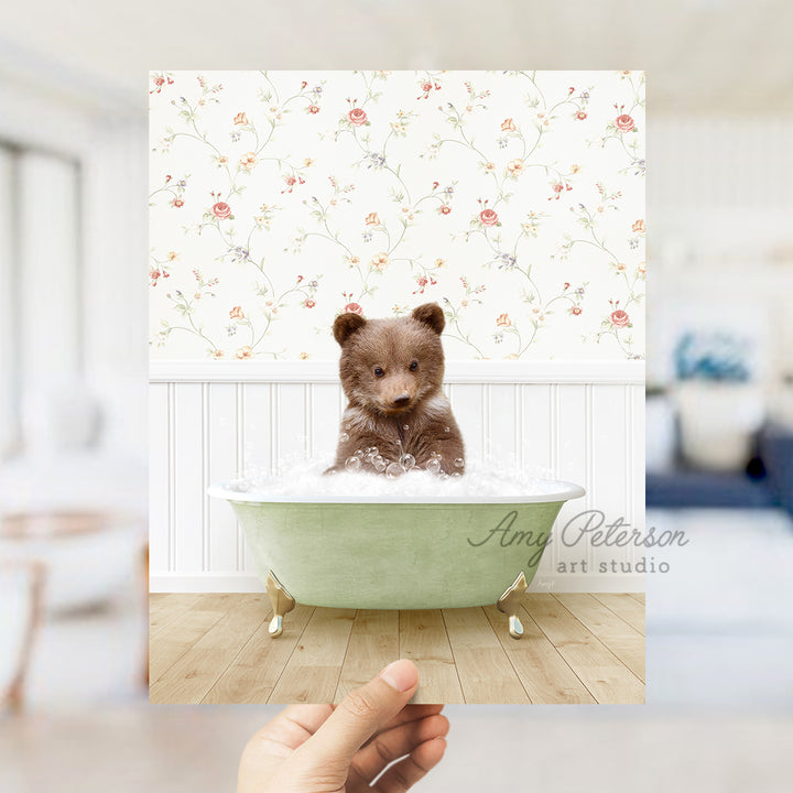 a small teddy bear sitting in a bath tub